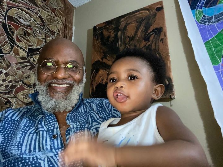 a picture of moyo okedijis with his grand daughter